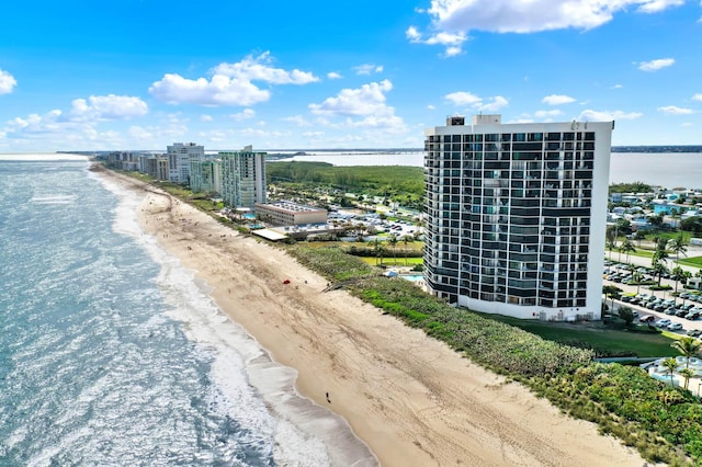 birds eye view of property featuring a view of the beach and a water view