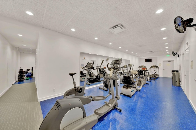 workout area with a paneled ceiling