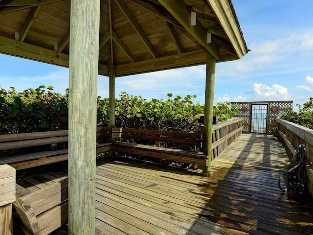 wooden terrace featuring a gazebo