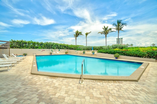 view of swimming pool with a patio