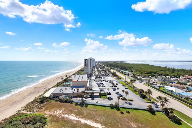 bird's eye view with a water view and a view of the beach