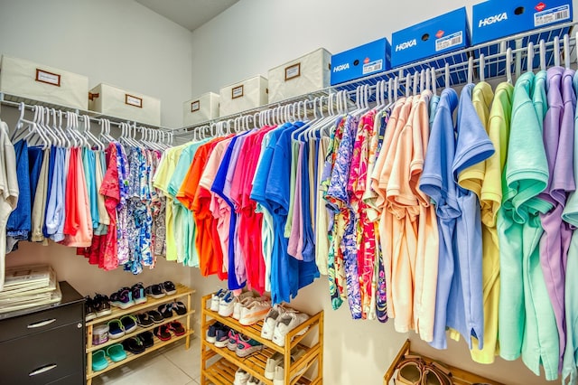 walk in closet with tile patterned floors