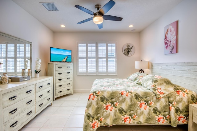 bedroom featuring light tile patterned floors and ceiling fan