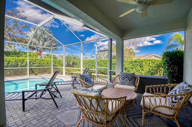 view of patio / terrace with a lanai, an outdoor hangout area, and ceiling fan