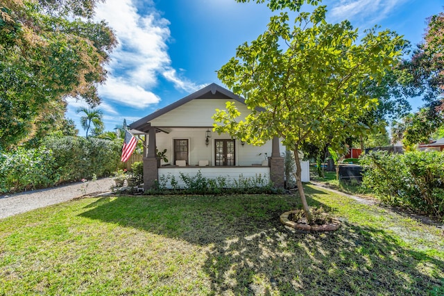 view of front of house featuring french doors and a front lawn