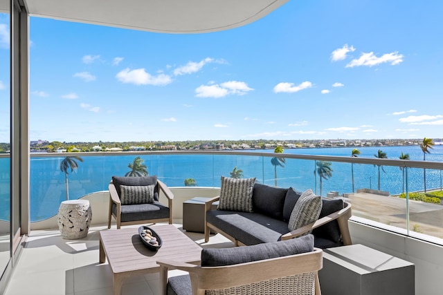 balcony featuring a water view