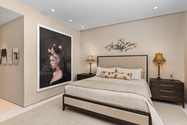 carpeted bedroom with a water view and expansive windows