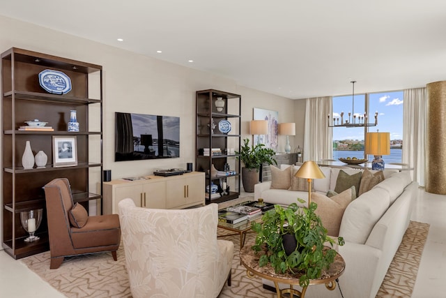 living area with recessed lighting, a notable chandelier, and floor to ceiling windows