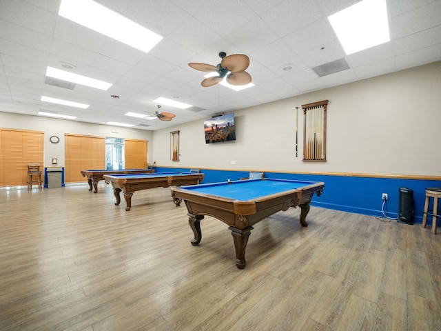 playroom featuring ceiling fan, pool table, a drop ceiling, and light hardwood / wood-style floors