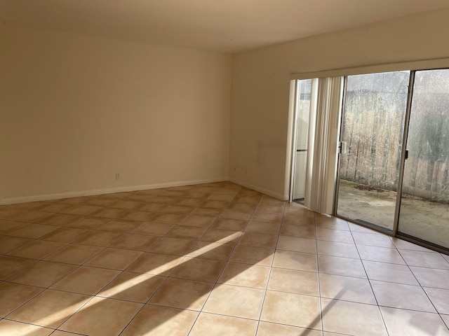 empty room featuring light tile patterned floors