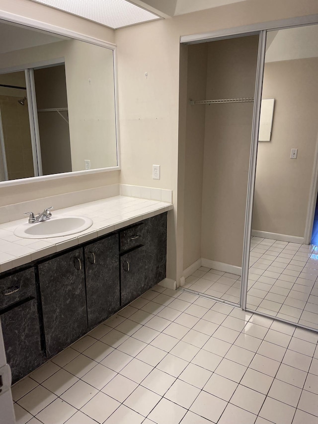 bathroom featuring vanity and tile patterned flooring