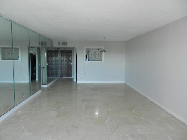 empty room with a textured ceiling