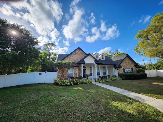 view of front of property with a front lawn and a porch