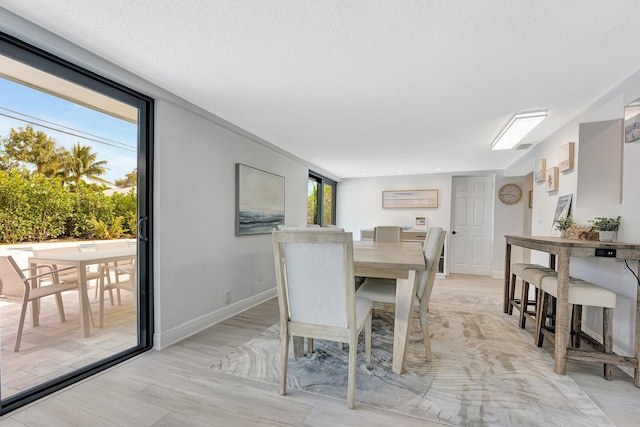 dining area with a textured ceiling