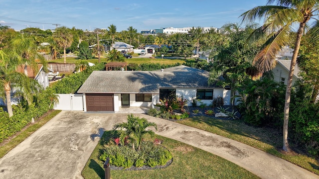 view of front of property featuring a garage and a front yard