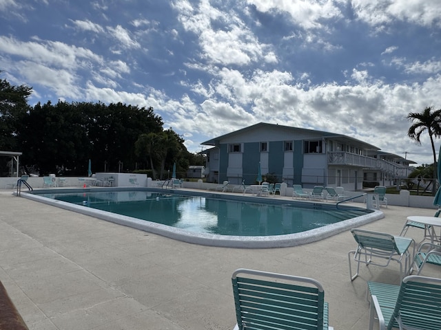 view of swimming pool with a patio