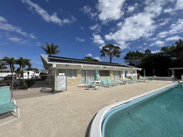 view of swimming pool with a patio area