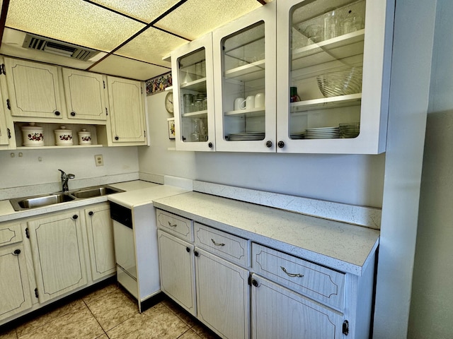 kitchen with sink and light tile patterned floors