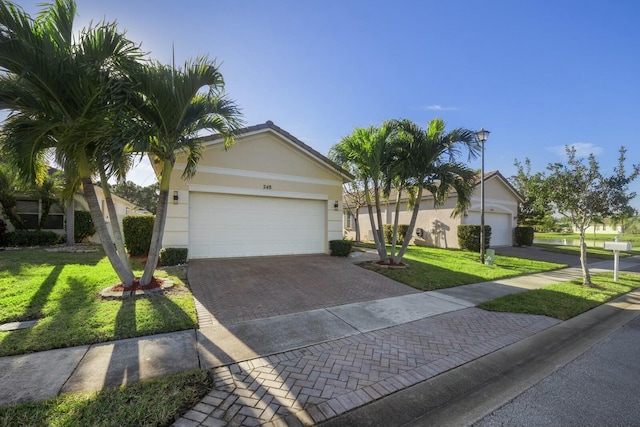 ranch-style home featuring a front yard