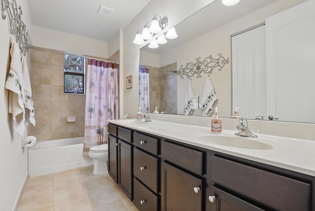 full bathroom featuring tile patterned flooring, vanity, toilet, and shower / bath combo with shower curtain