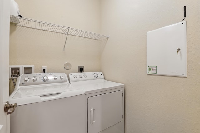 washroom featuring independent washer and dryer