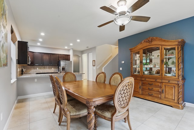 tiled dining room with ceiling fan