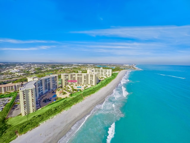 birds eye view of property with a view of the beach and a water view