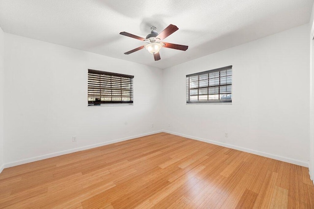 unfurnished room featuring ceiling fan and light wood-type flooring