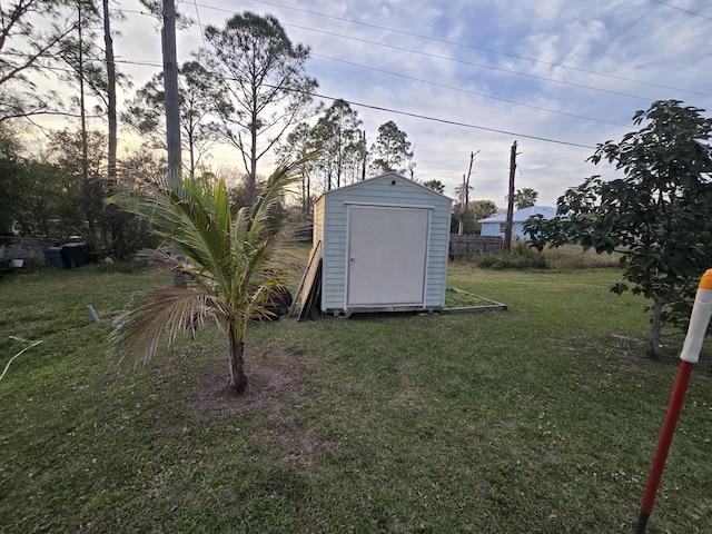 yard at dusk with a storage unit