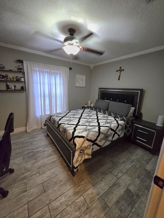 bedroom with crown molding, a textured ceiling, and ceiling fan