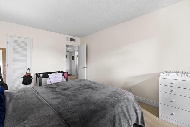 bedroom featuring a textured ceiling