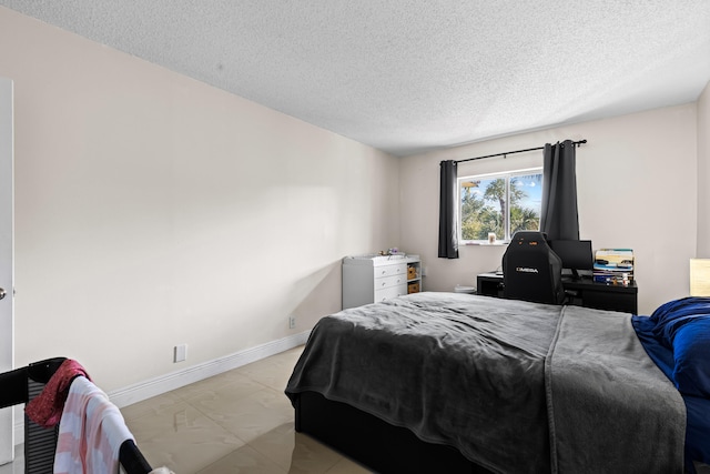 bedroom featuring a textured ceiling