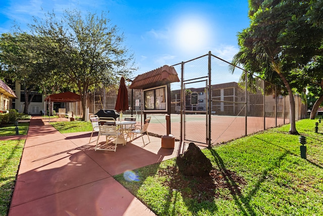 view of patio with tennis court