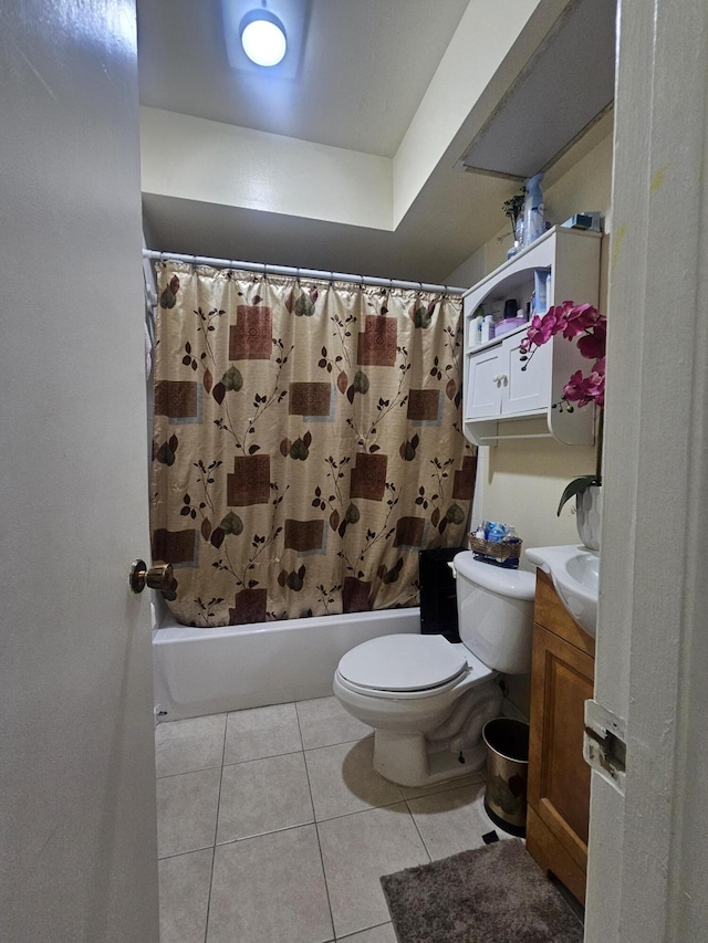 full bathroom featuring tile patterned floors, vanity, toilet, and shower / tub combo