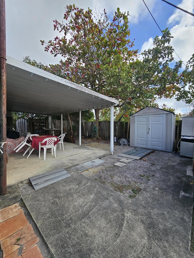 view of patio / terrace with a shed