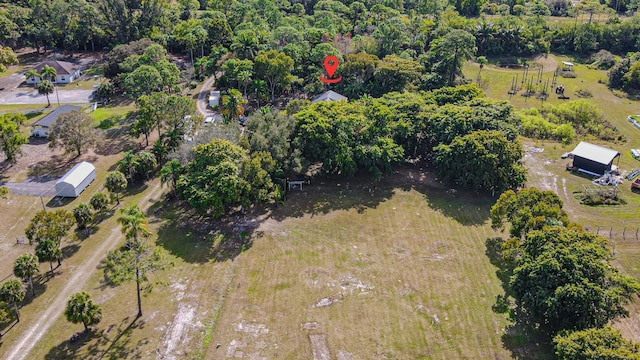 birds eye view of property featuring a rural view