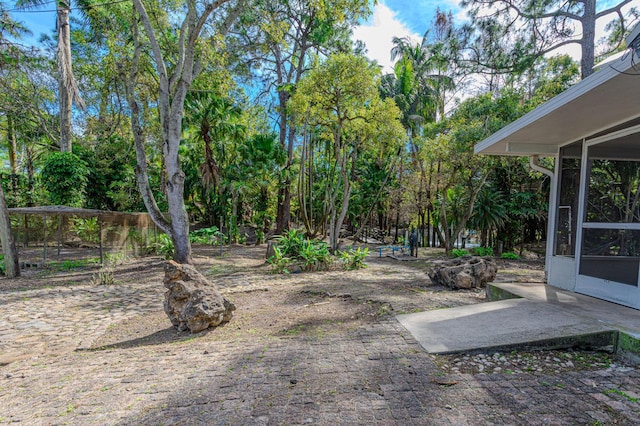 view of yard with a sunroom