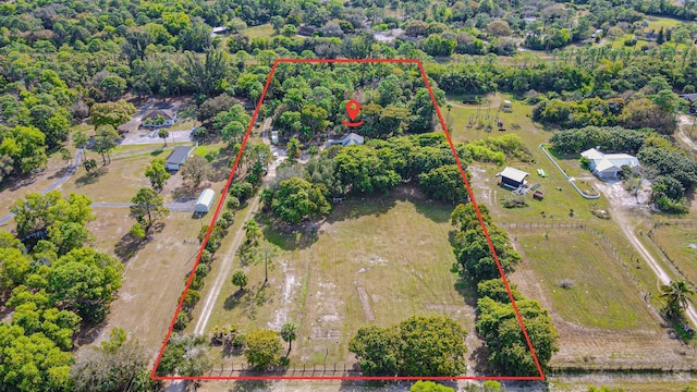 birds eye view of property featuring a rural view