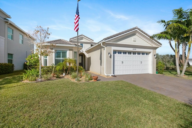 view of front of property with a garage and a front yard