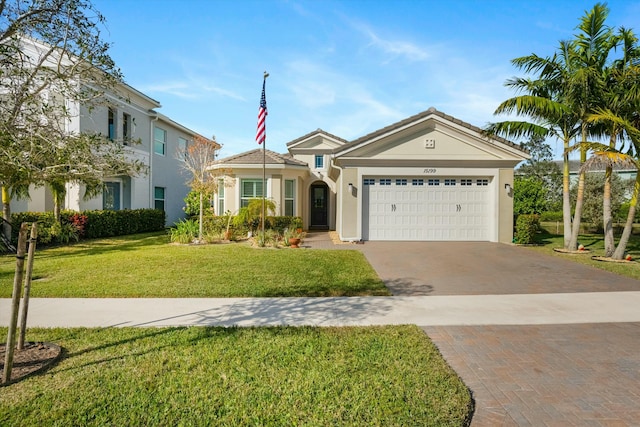 view of front facade featuring a garage and a front yard