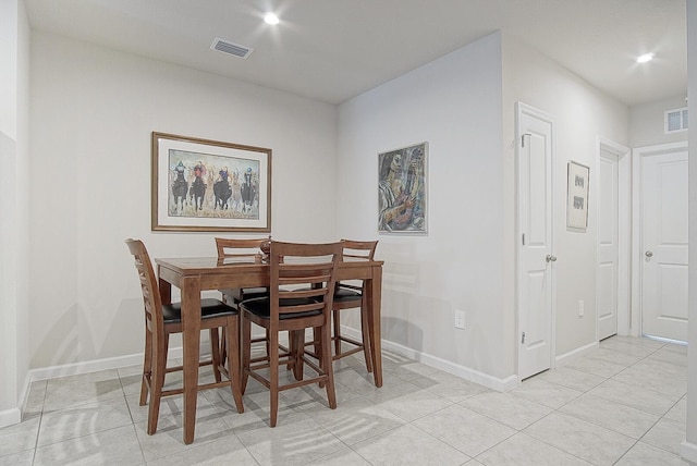 828 Persimmon Pl, Fort Pierce, FL 34981 - dining area featuring light tile patterned floors, baseboards, and recessed lighting