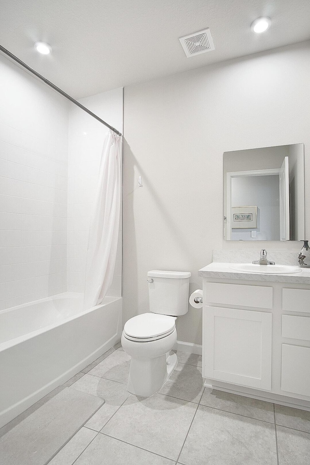 full bathroom featuring vanity, toilet, tile patterned flooring, and shower / bath combo with shower curtain