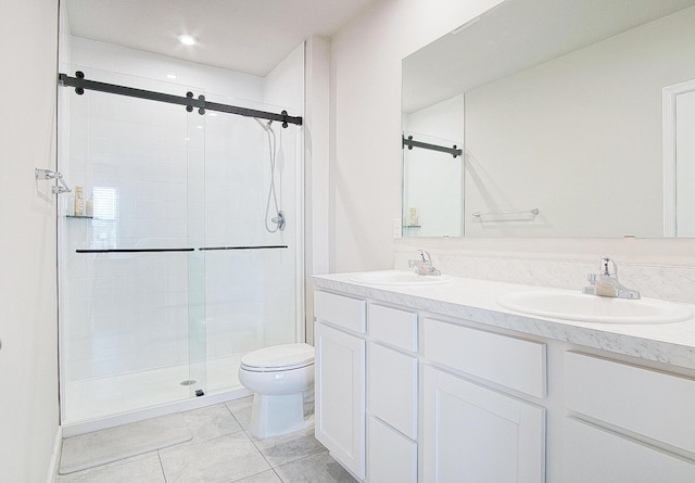 828 Persimmon Pl, Fort Pierce, FL 34981 - bathroom featuring a stall shower, toilet, double vanity, tile patterned floors, and recessed lighting