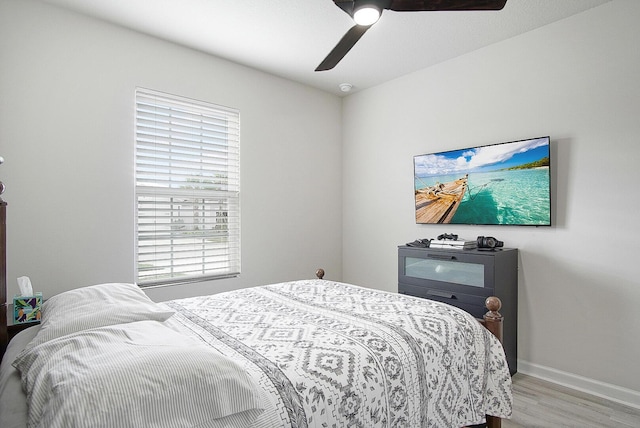 828 Persimmon Pl, Fort Pierce, FL 34981 - bedroom featuring wood finished floors, baseboards, and ceiling fan