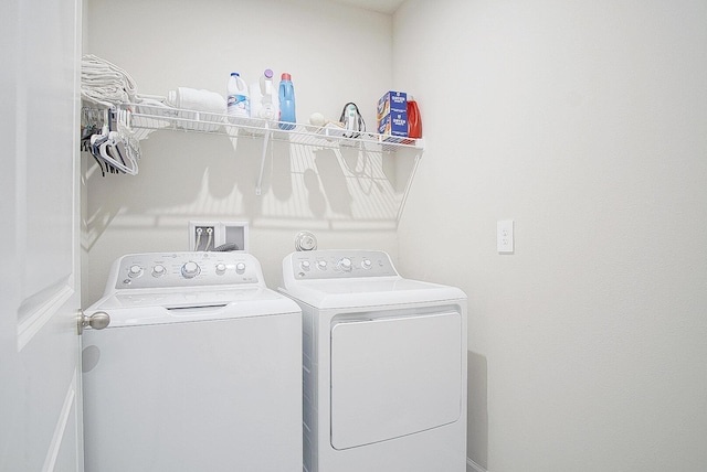 washroom featuring washing machine and dryer