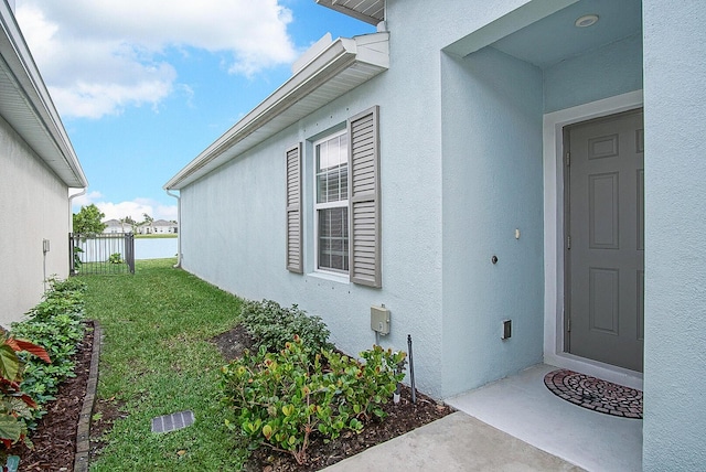 828 Persimmon Pl, Fort Pierce, FL 34981 - view of exterior entry featuring stucco siding