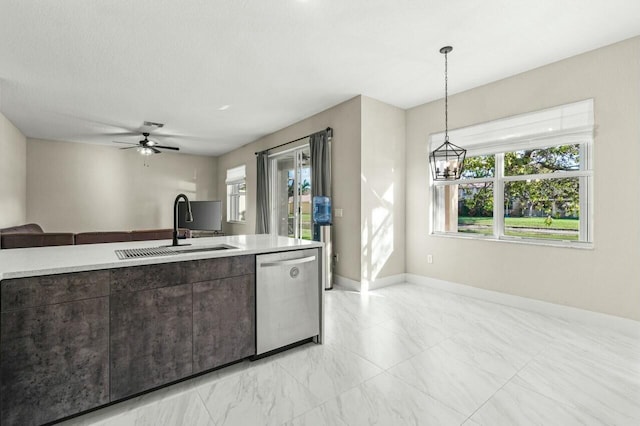 kitchen with hanging light fixtures, ceiling fan with notable chandelier, sink, and dishwasher