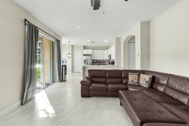 living room featuring ceiling fan