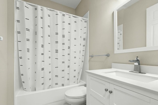 full bathroom with vanity, toilet, and shower / bath combo with shower curtain