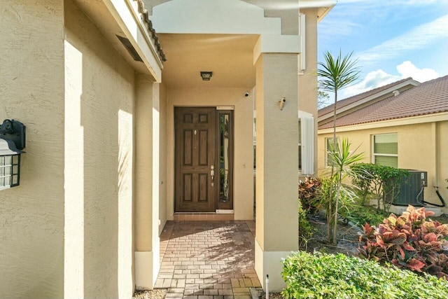 doorway to property featuring cooling unit